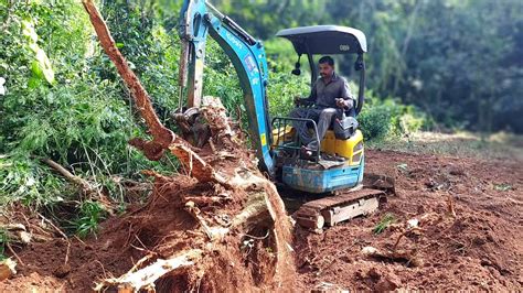 mini excavator.tree work|mini tree removal machine.